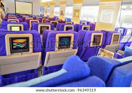 SINGAPORE - FEBRUARY 17: Inflight entertainment system in economy class cabin in Singapore Airlines\' (SIA) last Boeing 747-400 aircraft at Singapore Airshow on February 17, 2012 in Singapore