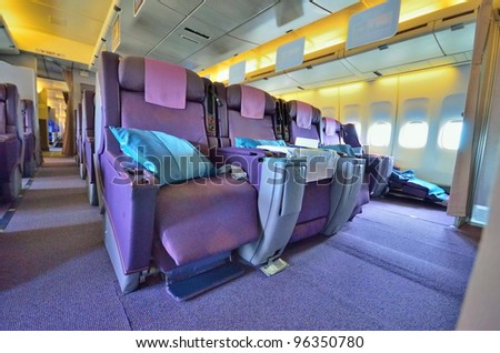 SINGAPORE - FEBRUARY 17: Front row of business class seats in Singapore Airlines\' (SIA) last Boeing 747-400 aircraft at Singapore Airshow on February 17, 2012 in Singapore