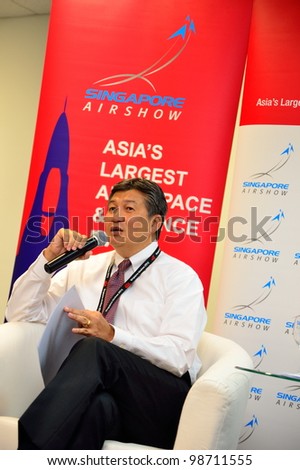 SINGAPORE - FEBRUARY 17: Mr Jimmy Lau, Managing Director of Experia Events, speaking at the wrap-up media briefing at Singapore Airshow February 17, 2012 in Singapore