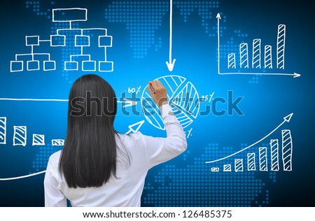 working women hand drawing business graph