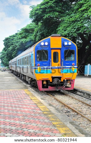 Thai colorful train arriving at station