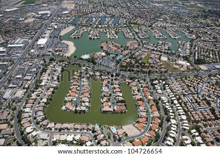 View from above of a man made lake housing community in the desert