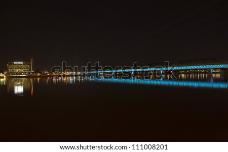 Lights on the light rail bridge light up Tempe Town Lake