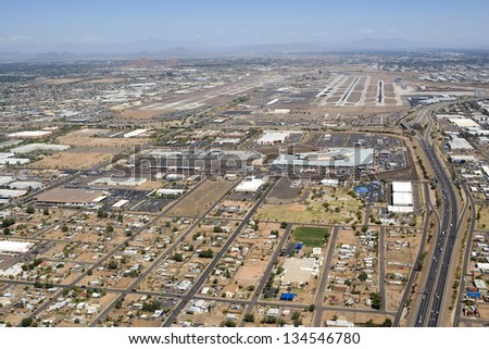 Major international airport aerial view with rental car center and Interstate 10 access