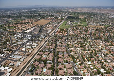 stock-photo-aerial-view-of-rooftops-and-amenities-in-northwest-mesa-arizona-74398849.jpg