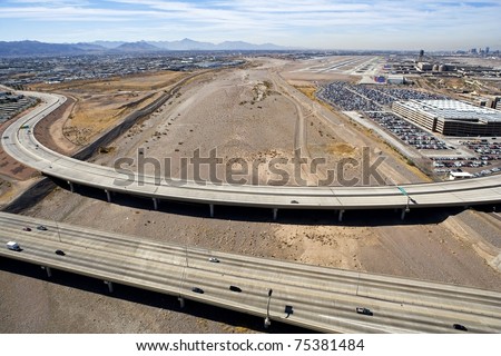 Aerial view of the bridges of State Routes 143 and 153 over the dry Salt River bed in Phoenix, Arizona
