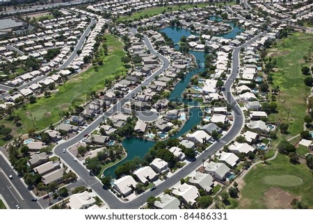 Suburbia with Swimming Pools on man made lake
