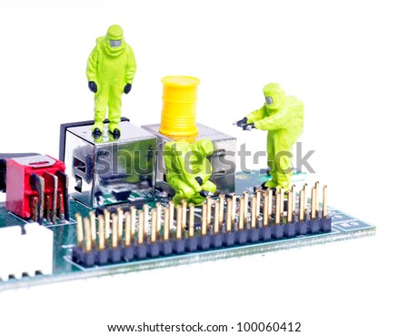 tiny figures of chemical team in hazmat suits examining  integrated circuit