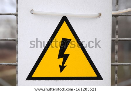 electricity warning sign - black lighting on yellow triangle