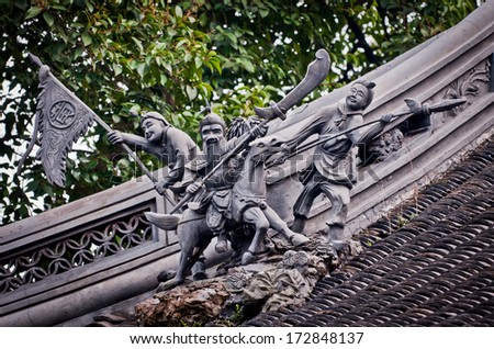 Chinese warriors figures on roof in YuYuan Garden in Shanghai, China