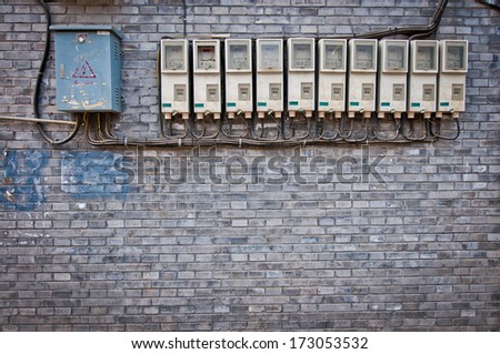 row of electricity meters and fuse boxes in hutong area, Beijing, China