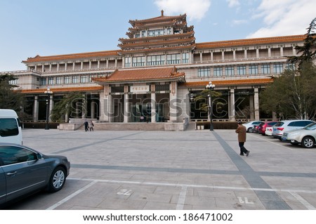 BEIJING, CHINA - APRIL 1: Chinese people walks in front of The National Art Museum of China building at 1 Wusi Ave in Dongcheng District on March 31, 2013 in Beijing on April 1, 2013 in Beijing