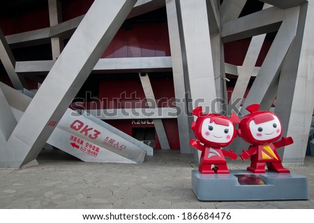 BEIJING, CHINA - APRIL 2: 2008 Summer Olympic Games mascots in front of National Stadium in Chaoyang District, commonly known as Bird\'s Nest on April 2, 2013 in Beijing