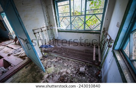 wooden cottage in small abandoned village called Stechanka in Chernobyl Nuclear Power Plant Zone of Alienation, Ukraine