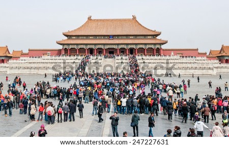 BEIJING, CHINA - MARCH 28: Chinese and foreign tourists in front of Hall of Supreme Harmony (Taihedian) on the Outer Court of Frobidden City on March 28, 2013 in Beijing