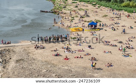 WARSAW, POLAND - JULY 27: people rests on the Vistula River beach on July 27, 2014 in Warsaw