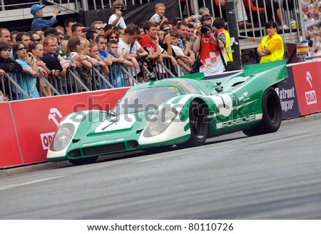 WARSAW - JUNE 18: David Piper driving Porsche 917k car during VERVA Street Racing Show on June 18, 2011 in Warsaw, Poland. It is largest event of its kind held in Poland.