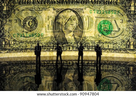 silhouettes of tiny businessman figures against one dollar bill