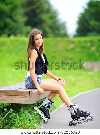 Girl with rollers on bench
