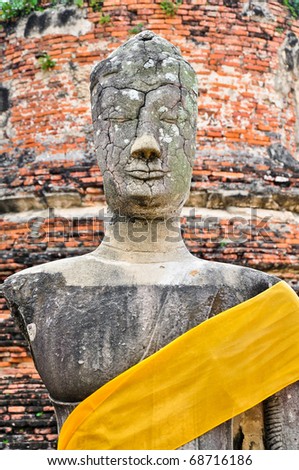 This ruin image of Buddha is in Ayutthaya historical park where is an old capital city of Thailand. It was destroyed by Myanmar troop.