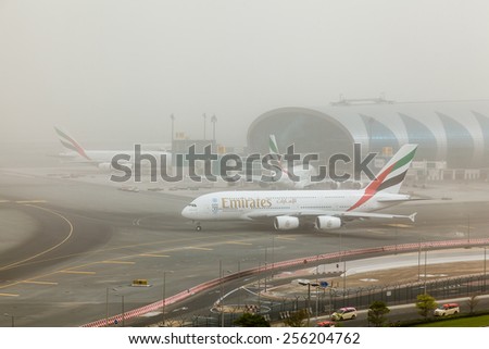 DUBAI - FEBRUARY 21: Emirates A380 is taxiing for take off in a sand storm not in a foggy day as seen on February 21, 2015.