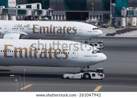 DUBAI - FEBRUARY 28: Two Emirates planes are getting ready to taxi for take off as seen on February 28, 2013.