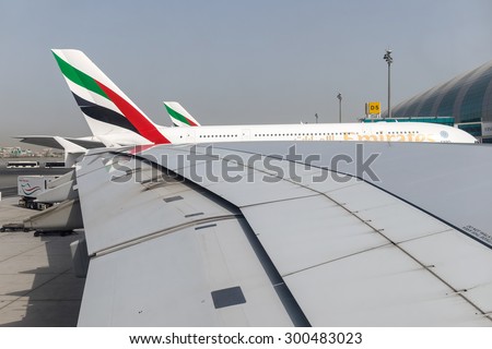 DUBAI - JULY 15: A wing and window view of an Airbus A380 taken before departure and push back from the gate as seen on July 15, 2015.