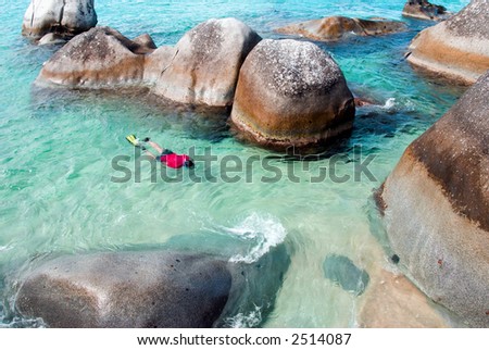 A man snorkeling at The Baths on Virgin Gorda in the British Virgin Islands.