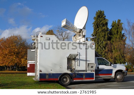 A North American TV news truck in the fall.