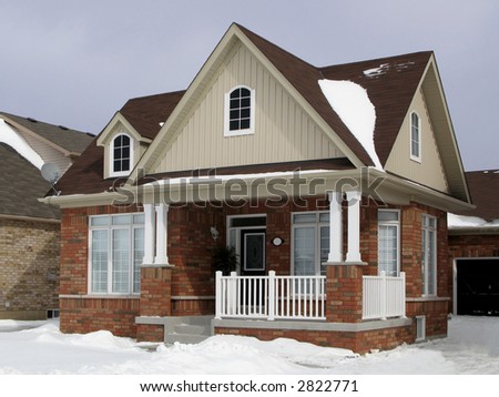 A small suburban house in winter.
