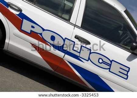 Police sign on the side of a North American cruiser.
