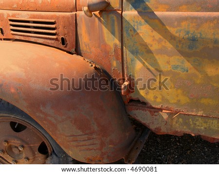 Detail of a very rusty truck door.