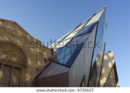 The north face of the Royal Ontario Museum in Toronto, Canada, showing part of the new Michael Lee-Chin Crystal extension designed by Daniel Libeskind, dappled by the earling morning sunlight.