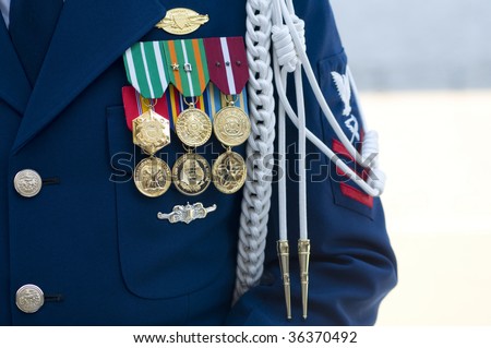 The medals, buttons, and badges of a US Coast Guard Company Commander.