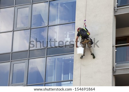 Building maintenance: Man working at height