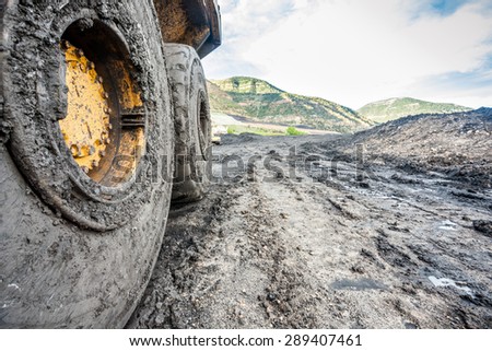 Close up of huge coal mining machines\' tires