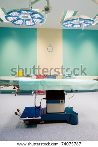 Operating room in hospital - close-up of bed and lights