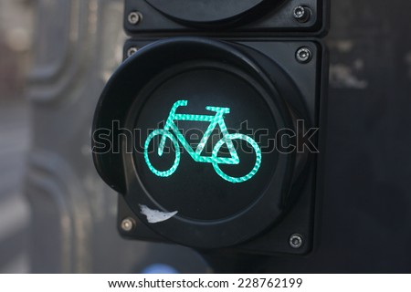 Green light sign for bicycle lane on a traffic light
