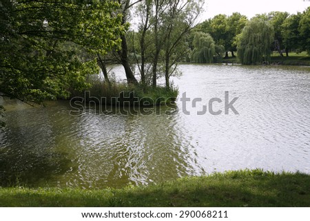Lakeside summer atmosphere in shadow without people rural scene