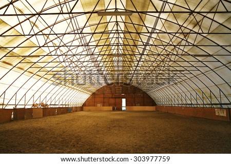 Indoor riding arena covering sand for trainings