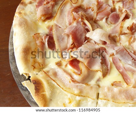 Smoke bacon pizza on table in restaurant
