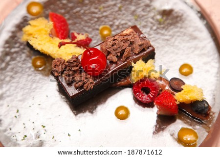 Sacher cake with berry and topping