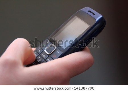 Closeup of texting on an old cell phone