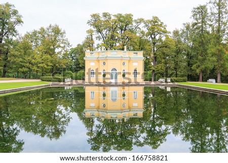 A house with a crystal clear reflection on a pond in St. Catherine Palace\'s park, St. Petersburg, Russia