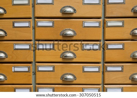 Detail of an apothecary cabinet with empty and blank labels