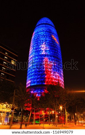BARCELONA, SPAIN - AUGUST 8: Torre Agbar illuminated at night on August 8, 2011 in Barcelona, Spain. This 38-storey tower was designed by architect Jean Nouvel