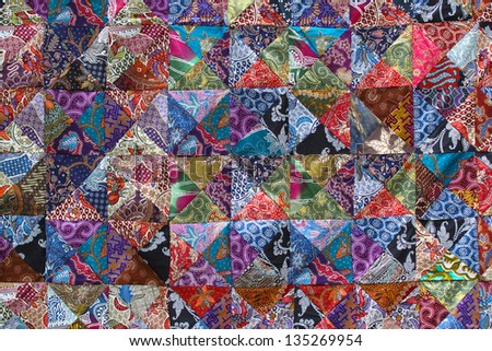 BALI, INDONESIA  - MARCH 9 : Assortment of colourful batik textile, made by not identified  actor, on display and for sale in special shop  on March 9, 2013 in Bali, Indonesia
