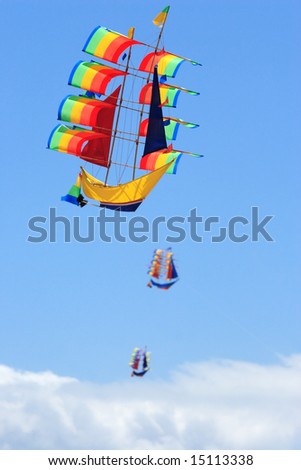 The flying ships on the blue sky background