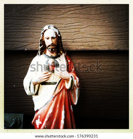 weathered statue of Jesus in the instagram style