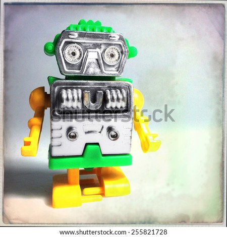 Instagram filtered image of a vintage toy plastic robot